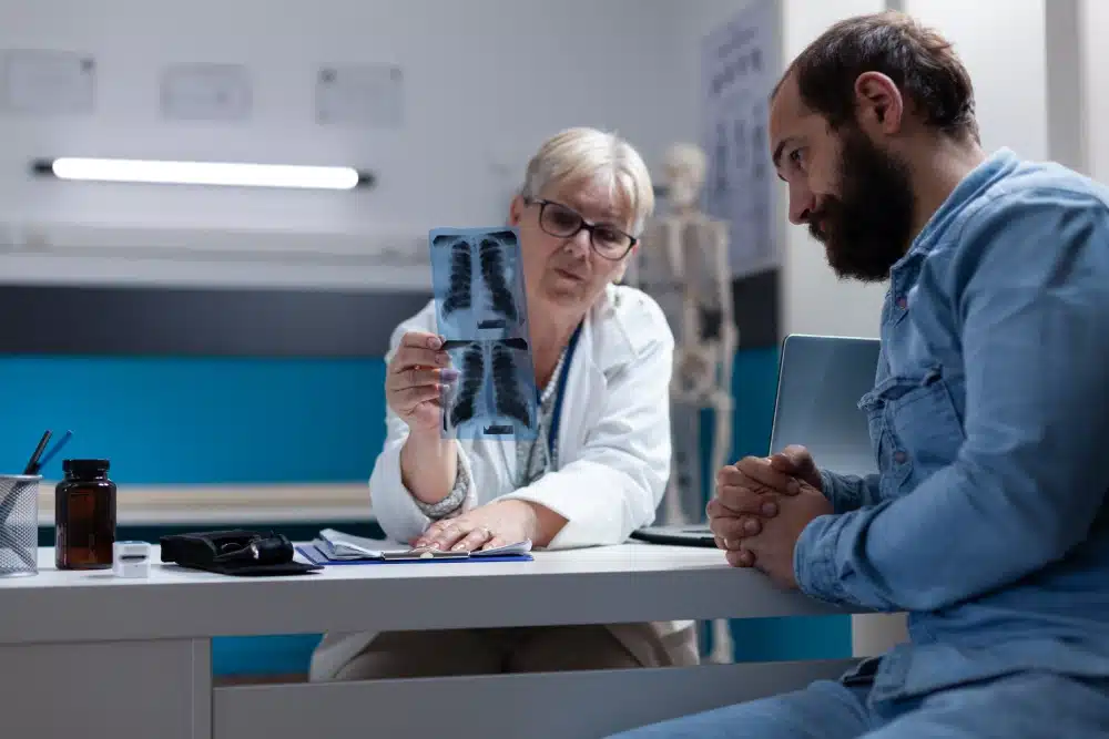 doctor-explaining-radiography-diagnosis-man-with-disease-checkup-visit-specialist-showing-x-ray-scan-results-patient-having-discussion-about-healthcare-medical-treatment
