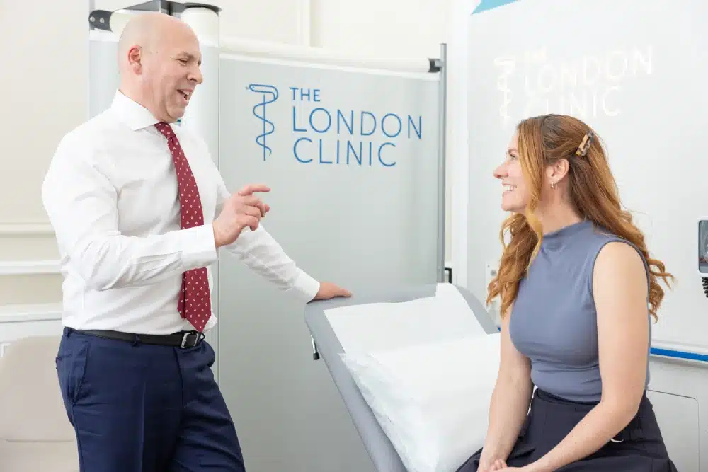 Marco Scarci explaining to a patient the process of surgery