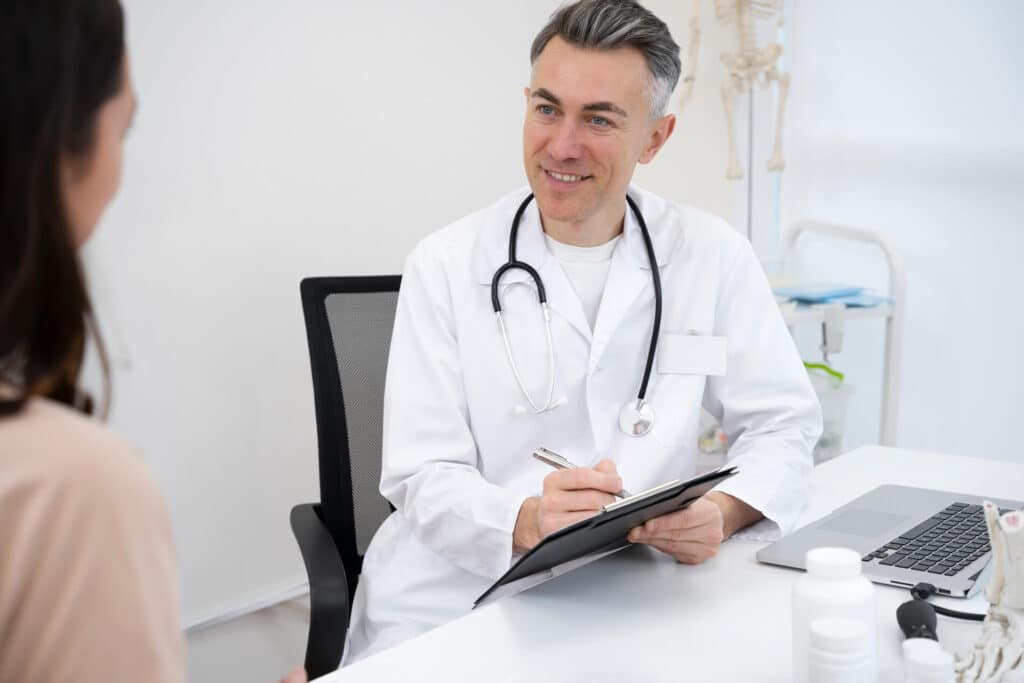 Rib Fracture Healing Time: What You Can and Can't Do While Healing 3 UK Doctor Consultation with Patient